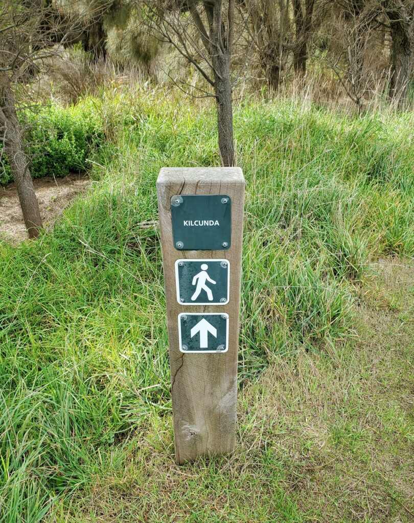 Signpost showing direction to Kilcunda along George Bass Coastal Walk